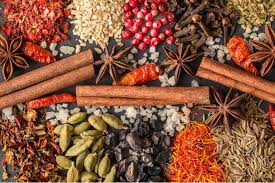 Whole spices displayed in bowls